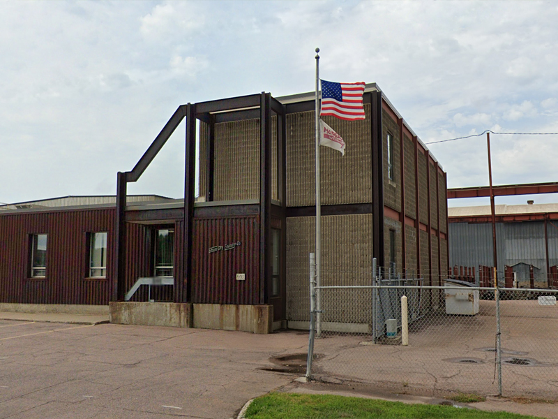 Front view of Sioux City Foundry building in Sioux City, IA after the spray foam roofing application, showcasing enhanced durability and waterproofing