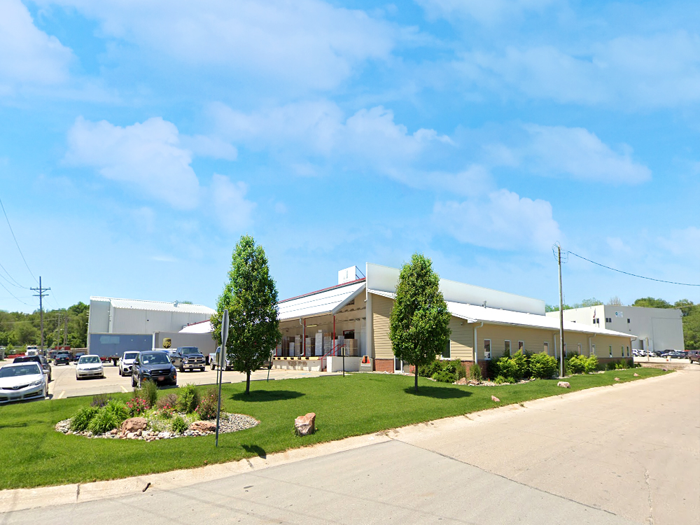 Front view of American Feed & Farm Supply, Inc. building in Omaha, NE after the spray foam roofing application, showcasing enhanced durability and waterproofing