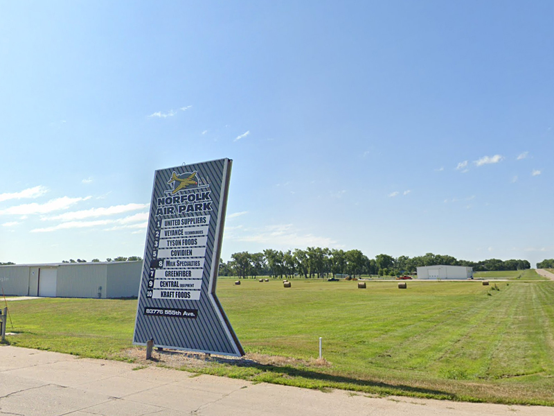 Sign with businesses listed at the Norfolk Airpark Industrial Track in Norfolk, NE