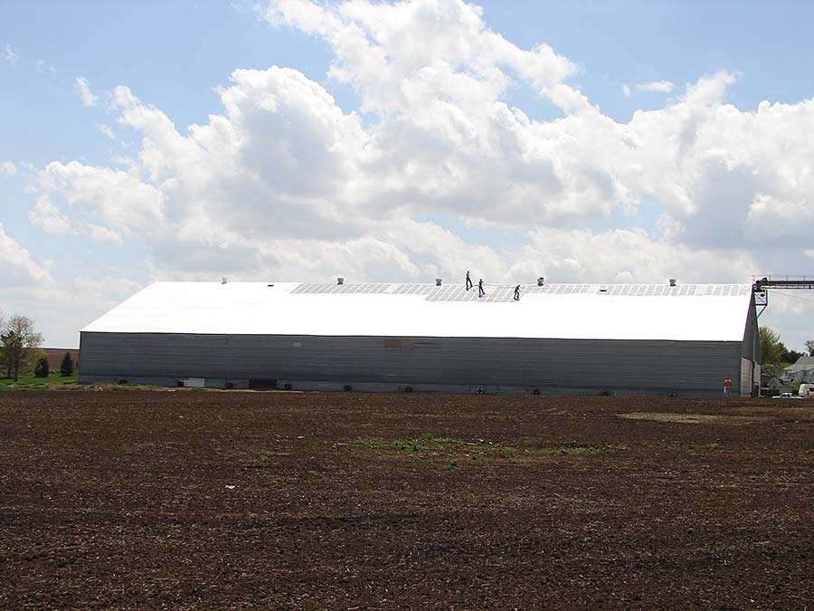 A far away view of the roof coating installation on the CHS, Inc facility in Magnet, NE